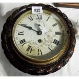 Dial wall clock within stained mahogany carved rope twist case, diameter 9'.