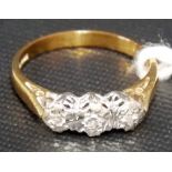 9ct gold three stone diamond ring, each stone of 0.05ct spread approx. within an illusion setting,
