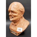 A WWII terracotta pottery table lighter modelled as a bust of Sir Winston Churchill, the back marked