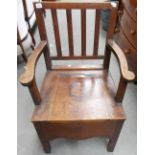 George III oak commode chair with square comb back.