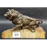 Bronzed spelter figure of a lion upon a white onyx base, width 8'.