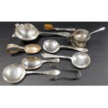 Selection of silver inc. a caddy spoon with trefid handle, Sheffield 1917, a tea strainer, eyebrow