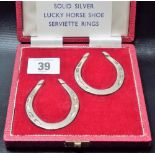Pair of modern silver horseshoe serviette rings, cased, Sheffield 1967, weight 1.5oz approx.