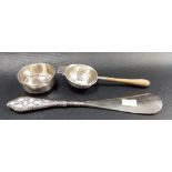 Silver tea strainer with turned wood handle, Birmingham 1957; together with a shoehorn with silver