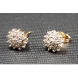 Pair of yellow metal & diamond chip cluster earrings, weight 1.3g approx