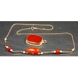 9ct gold mounted rectangular red stone pendant; together with a 9ct necklace with similar stone