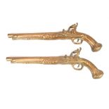 A pair early 20th century brass pistol wall hangings,