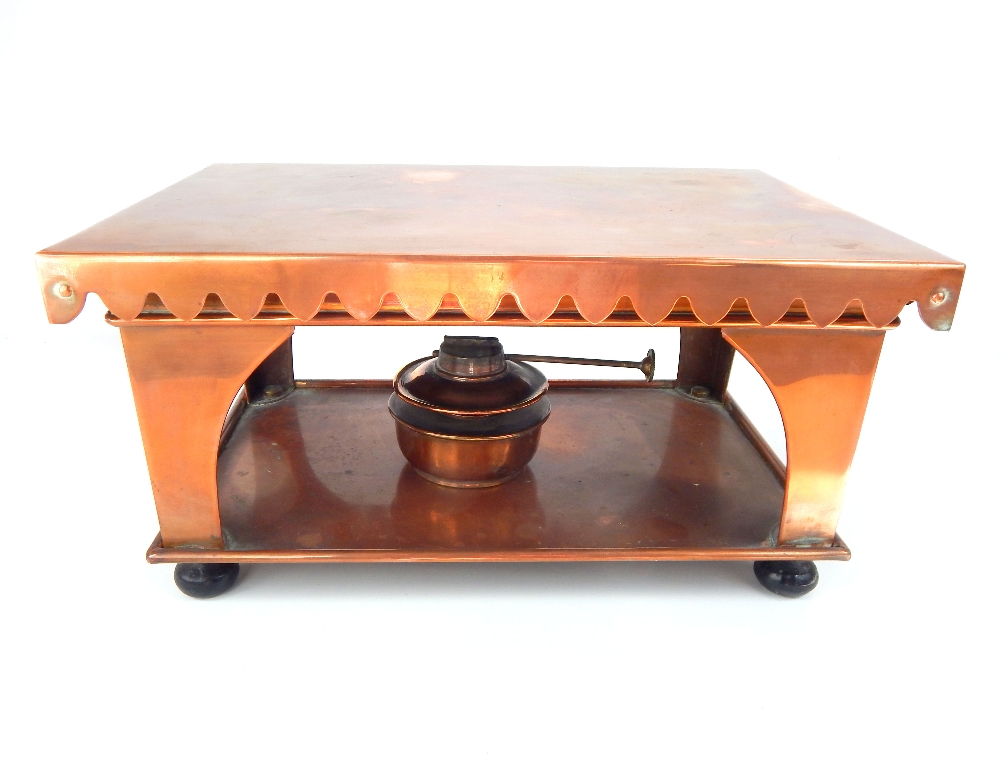 An Edwardian copper cooking / warm tray, of rectangular shape with shaped apron, raised on four