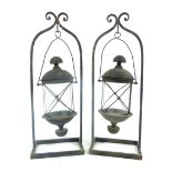 Pair of storm lanterns, candlestand with hanging frame, 64cm h