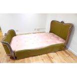 A 19th century French carved beech double bed, head and foot board, complete with side irons and