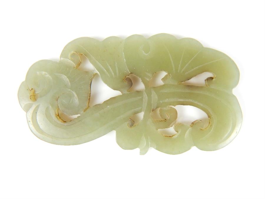 A carved Chinese jadeite jade Liangzhu pendant of a floral spray with incised detail decoration, 6cm