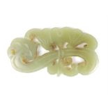 A carved Chinese jadeite jade Liangzhu pendant of a floral spray with incised detail decoration, 6cm