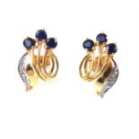 A pair of sapphire and diamond and gold earrings florette design.