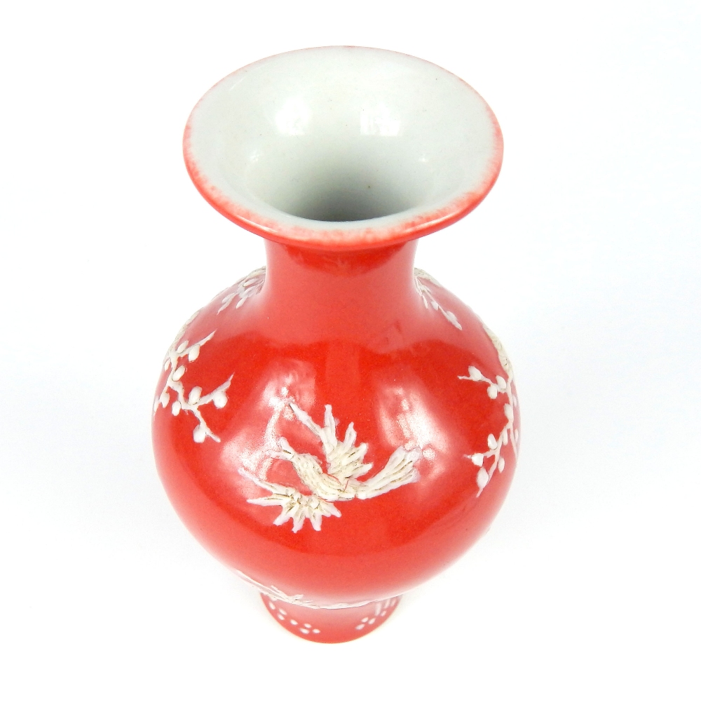 Chinese baluster vase everted rim, red glaze with white overlay of flowering prunus tree, six blue - Image 3 of 4