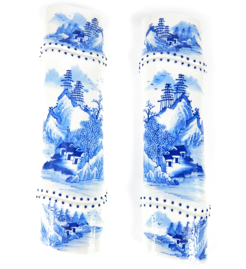 Pair of Chinese porcelain blue & white paperweights of faux bamboo form, with beads at the bamboo