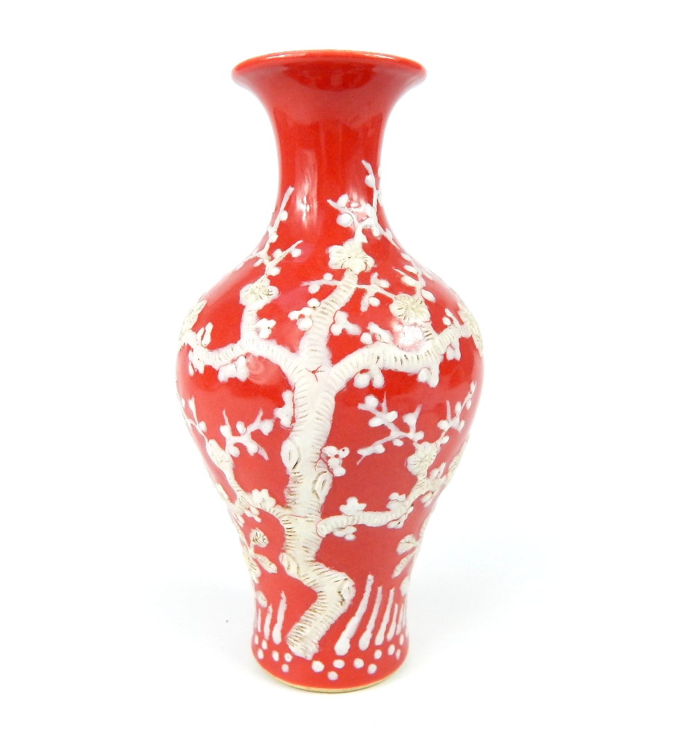 Chinese baluster vase everted rim, red glaze with white overlay of flowering prunus tree, six blue