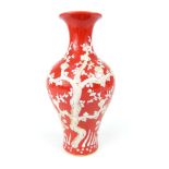 Chinese baluster vase everted rim, red glaze with white overlay of flowering prunus tree, six blue