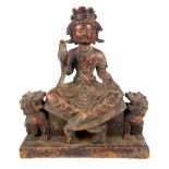 Chinese gilded cast iron statue of Guanyin, seated upon a plinth & guarded by two temple lions,