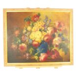 A large framed oil painting of a floral still life