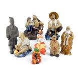A group of mid 20th century painted and enamelled models of Chinese figures in various positions,