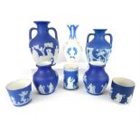 Two 19th century Wedgwood Jasperware twin handled vases, 21cm & 18cm, decorated with classical Roman