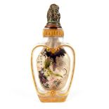 Chinese Peking glass snuff bottle of heart shape, mythical animal finial, floral gilding to the