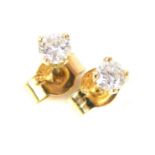 A pair of 9ct gold and diamond earrings.