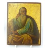 An early 19th C Romanian icon on panel of the prophet Elijah (llija) inscribed verso 22 x 18cm