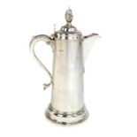 A large silver lidded flagon, hallmarked London 18