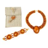 Amber necklace with multi cabochon drops and an amber bracelet with three roundels interlinked,