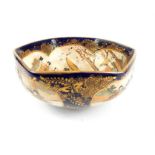 Japanese Satsuma hexagonal dish, blue glaze with gilt panels studies of ladies in the garden with