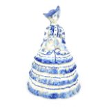 A Continental blue and white porcelain jar in the form of a C19th lady