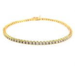 An 18ct gold diamond line bracelet. stamped Damias