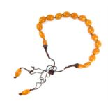 A chunky, fine amber bead necklace comprising of 19 polished large amber beads individually