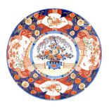 Japanese Imari charger, 19thC, blue glaze with central floral panel, other floral panels to rim, the