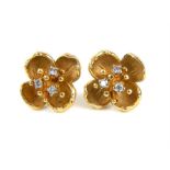 A pair of gold and diamond ear studs (15 ct gold)
