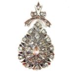 Distinctive white metal and diamond pendant