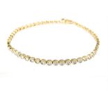 A 9 ct yellow gold and diamond tennis bracelet comprising 55 small round, brilliant cut diamonds