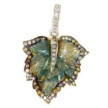 A gold and diamond mounted and carved moss agate leaf pendant.