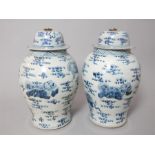 Pair of chinese blue and white vases with covers o