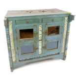 A large brightly painted Indian teak kitchen cabinet, with two narrow drawers above two pairs of