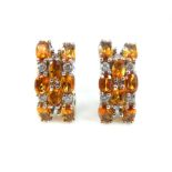 A pair of citrine and diamond clip earrings