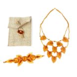 Amber multi link necklace, of 10 floating eyes, and a petal leaf bracelet, 43.5 grs gros (2)