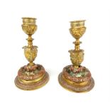 A pair of Victorian cast bronze candlesticks