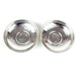 A pair of Cartier silver pin dishes