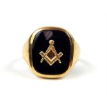 A 9 ct yellow gold and black onyxl masonic ring