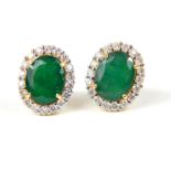 A pair of emerald and diamond cluster earrings