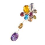 A contemporary designer silver and multi stone pendant set with faceted peridot, garnet, amethyst,