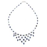 A fine 14 ct white gold and sapphire 'floating' design necklace, Length 20.5 cm