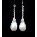 A pair of diamond and pearl drop earrings